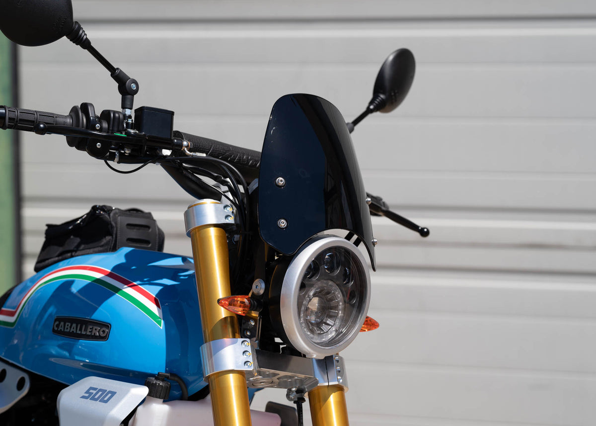 Fantic Caballero in blue with a dark tinted Dart Flyscreen